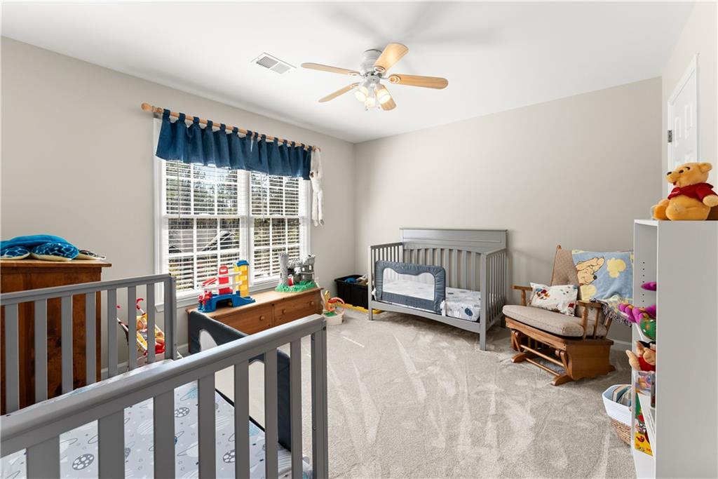 200 Morning Glory Ridge Canton, GA 30115 - Photo 44 of 88 a living room with furniture and a large window