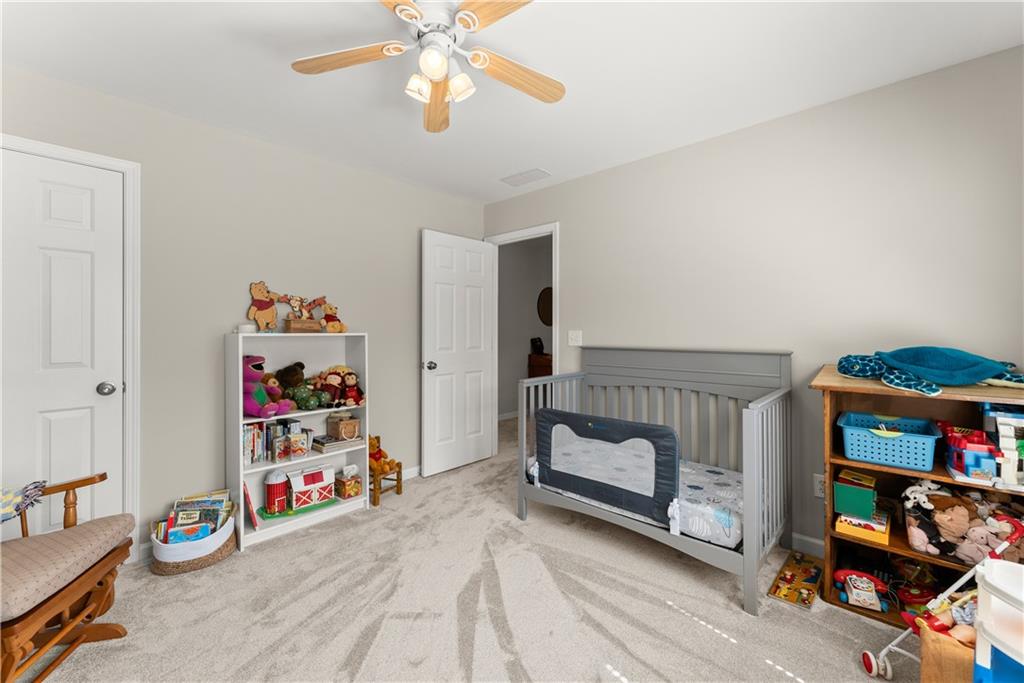 200 Morning Glory Ridge Canton, GA 30115 - Photo 45 of 88 a view of a room with toys and wooden floor