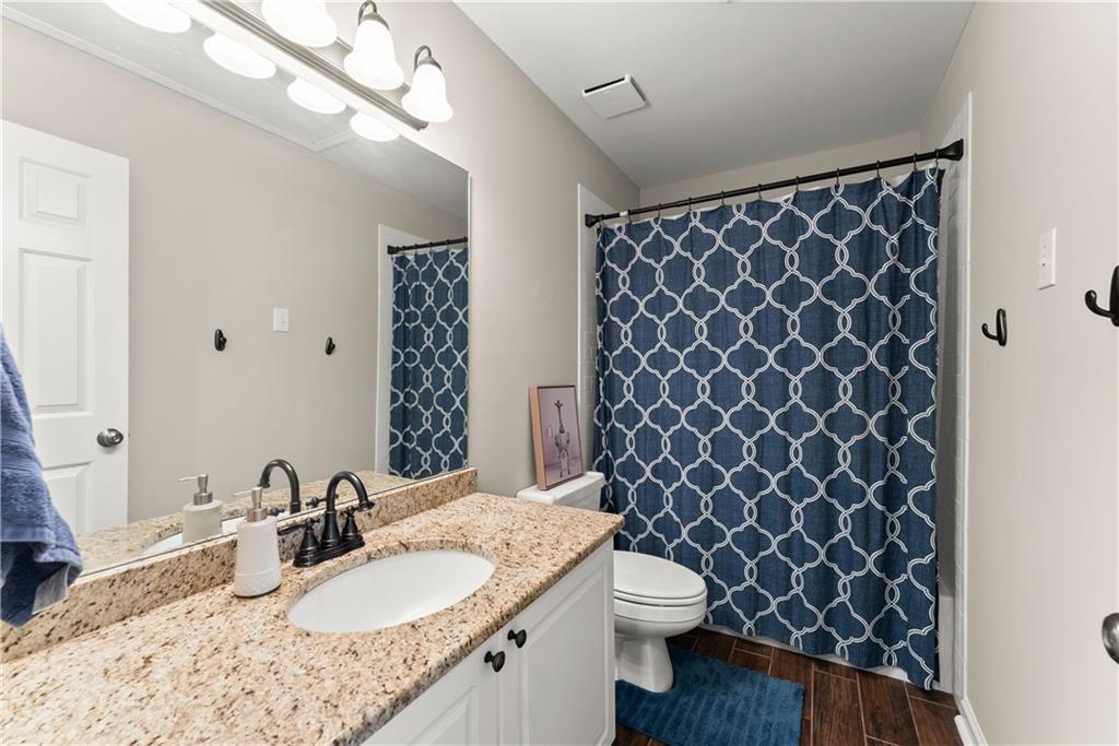 200 Morning Glory Ridge Canton, GA 30115 - Photo 48 of 88 a bathroom with a granite countertop sink and a mirror