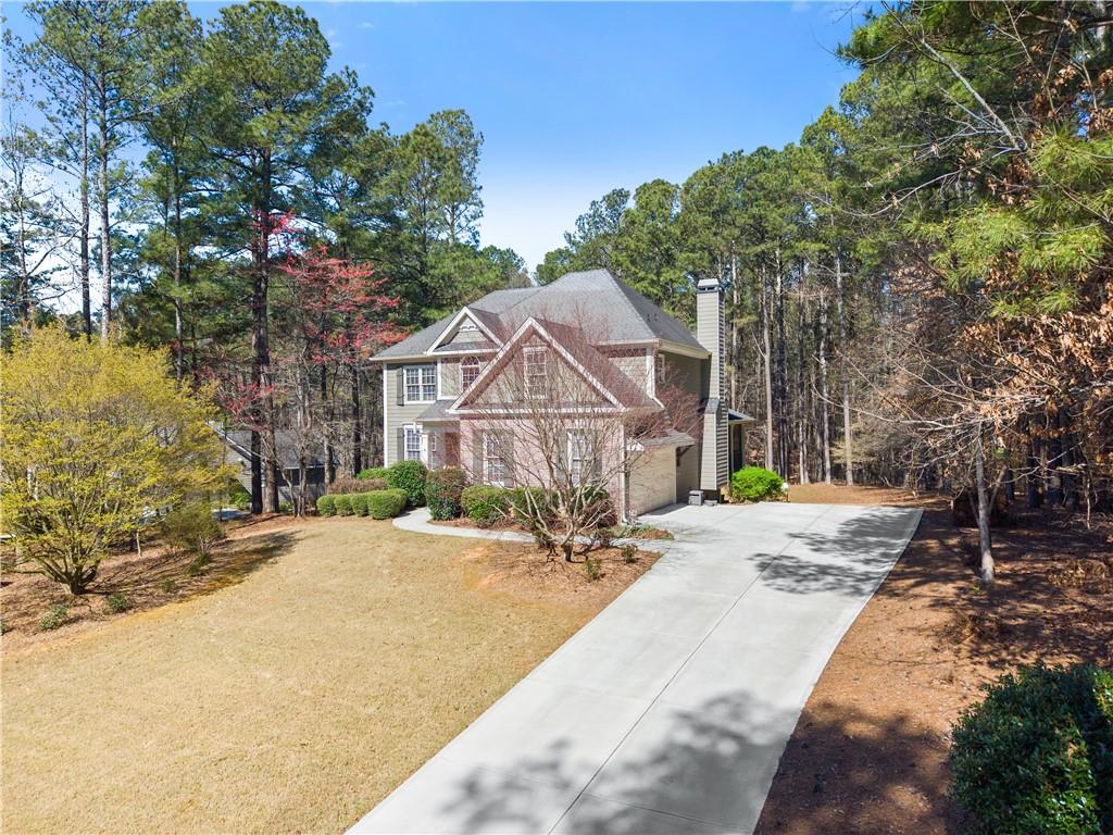 200 Morning Glory Ridge Canton, GA 30115 - Photo 88 of 88 a front view of a house with a yard and garage