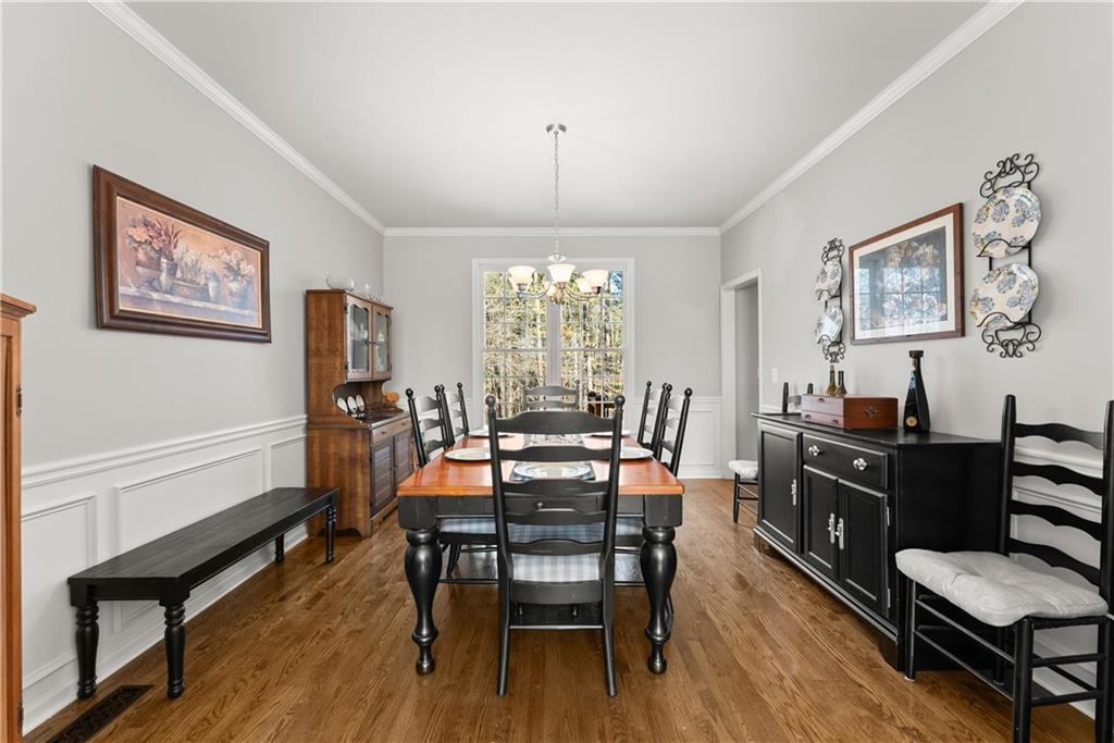 200 Morning Glory Ridge Canton, GA 30115 - Photo 10 of 88 a view of a dining room with furniture window and wooden floor