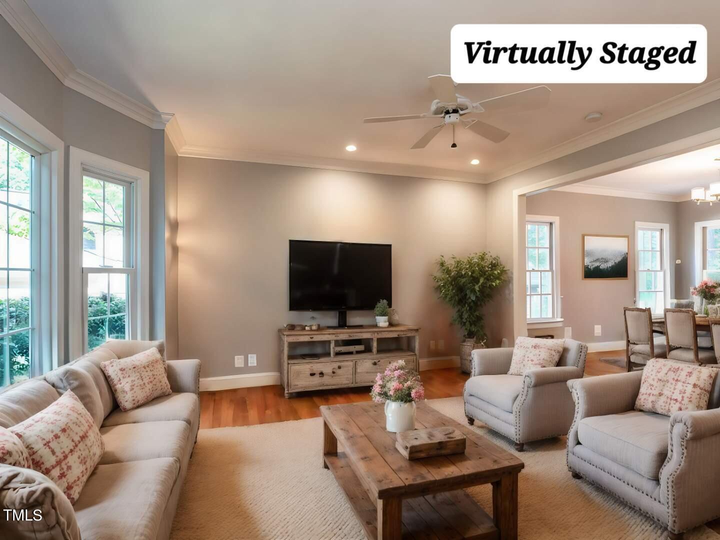 8805 Old Tom Way Raleigh, NC 27613 - Photo 6 of 43 a living room with furniture and a flat screen tv