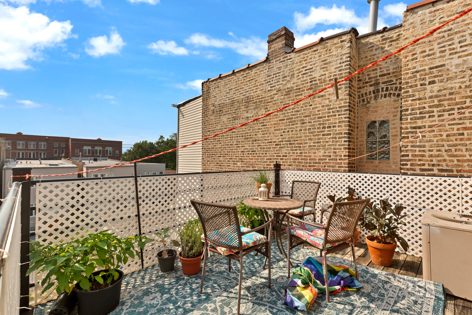 1422 North Maplewood Avenue Chicago, IL 60622 - Photo 6 of 9 a patio with table and chairs