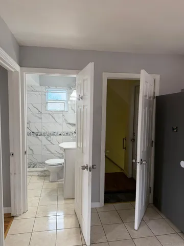 a bathroom with a shower and a sink