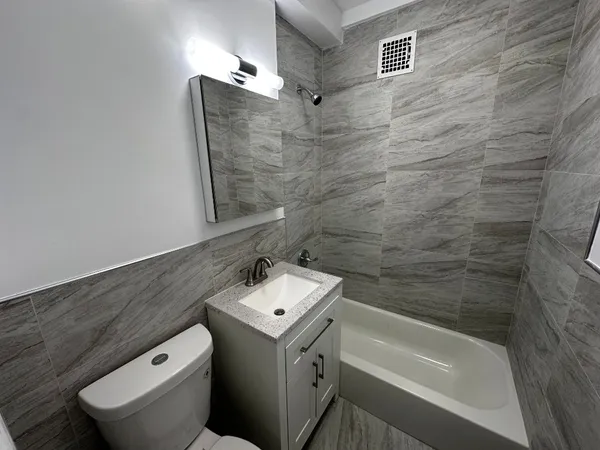a bathroom with a sink and toilet