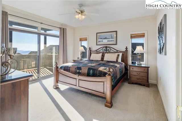 a spacious bedroom with a bed and a large window