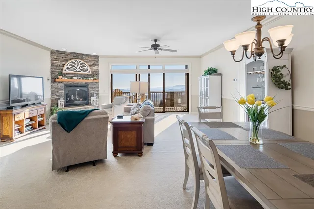 a living room with furniture and chandelier