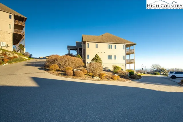 a view of chair and wooden floor in front of a door