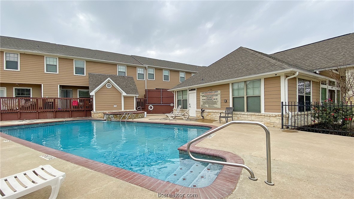 1000 Spring Loop, Unit 2105 College Station, TX 77840 - Photo 20 of 22 a view of a house with swimming pool and sitting area