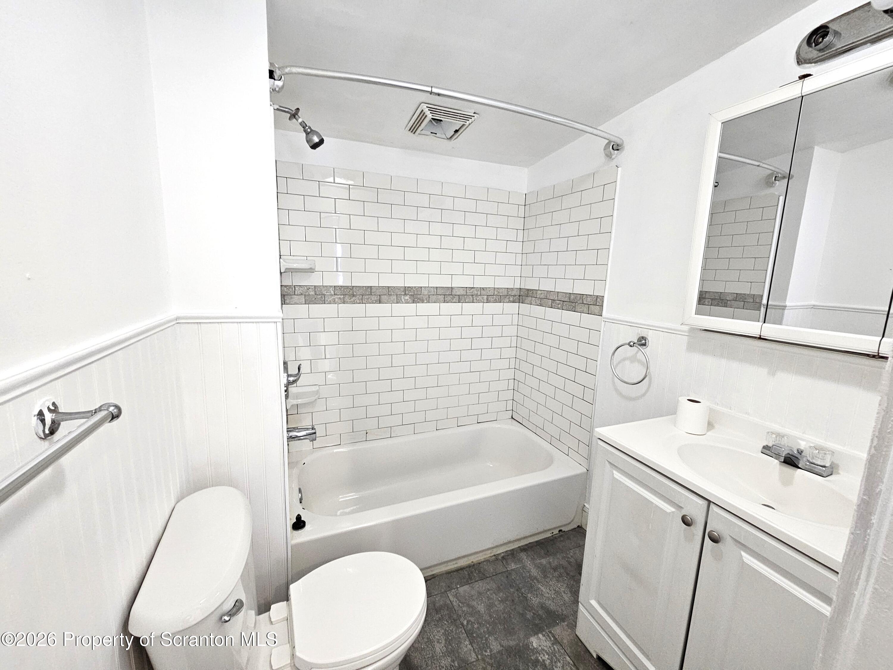 907 Green Ridge Street Scranton, PA 18509 - Photo 10 of 12 a bathroom with a sink toilet and shower