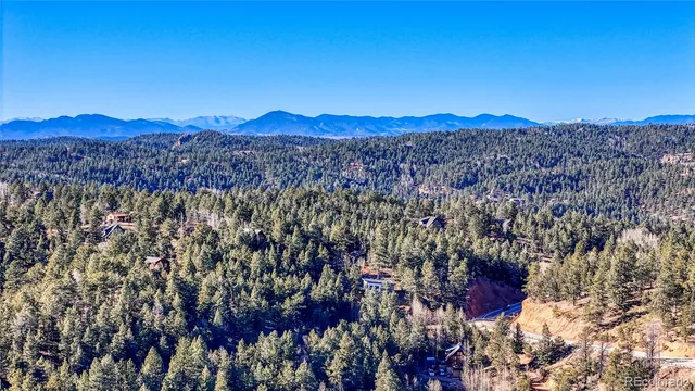 a view of a city with mountains in the background