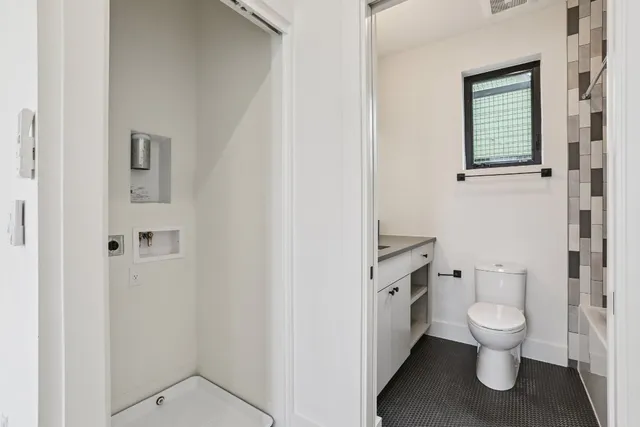 an empty room with windows and entrance