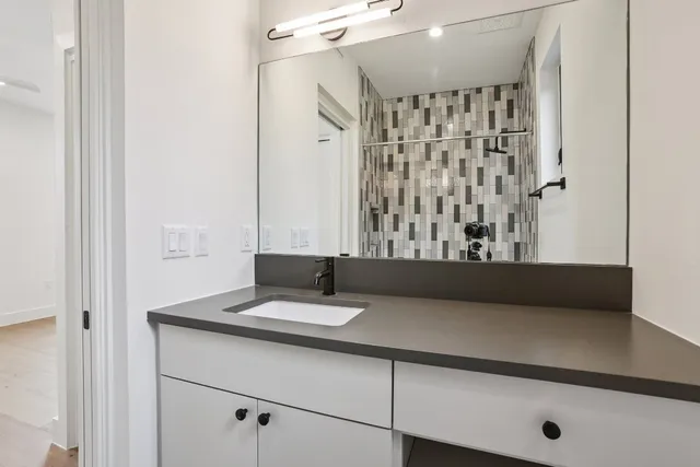 a bathroom with a toilet sink and shower