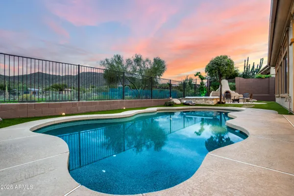 a view of a swimming pool with a sitting space