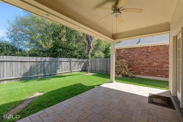 a view of a back yard of the house