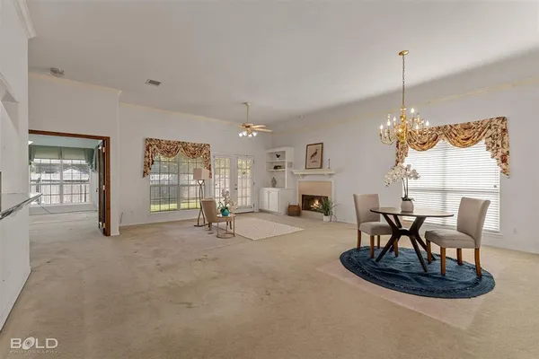 a dining room with furniture and window