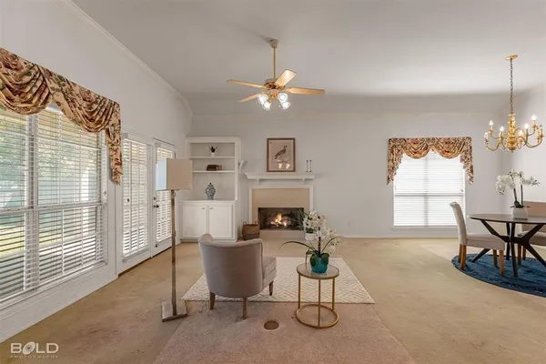 a view of a livingroom with furniture and a chandelier