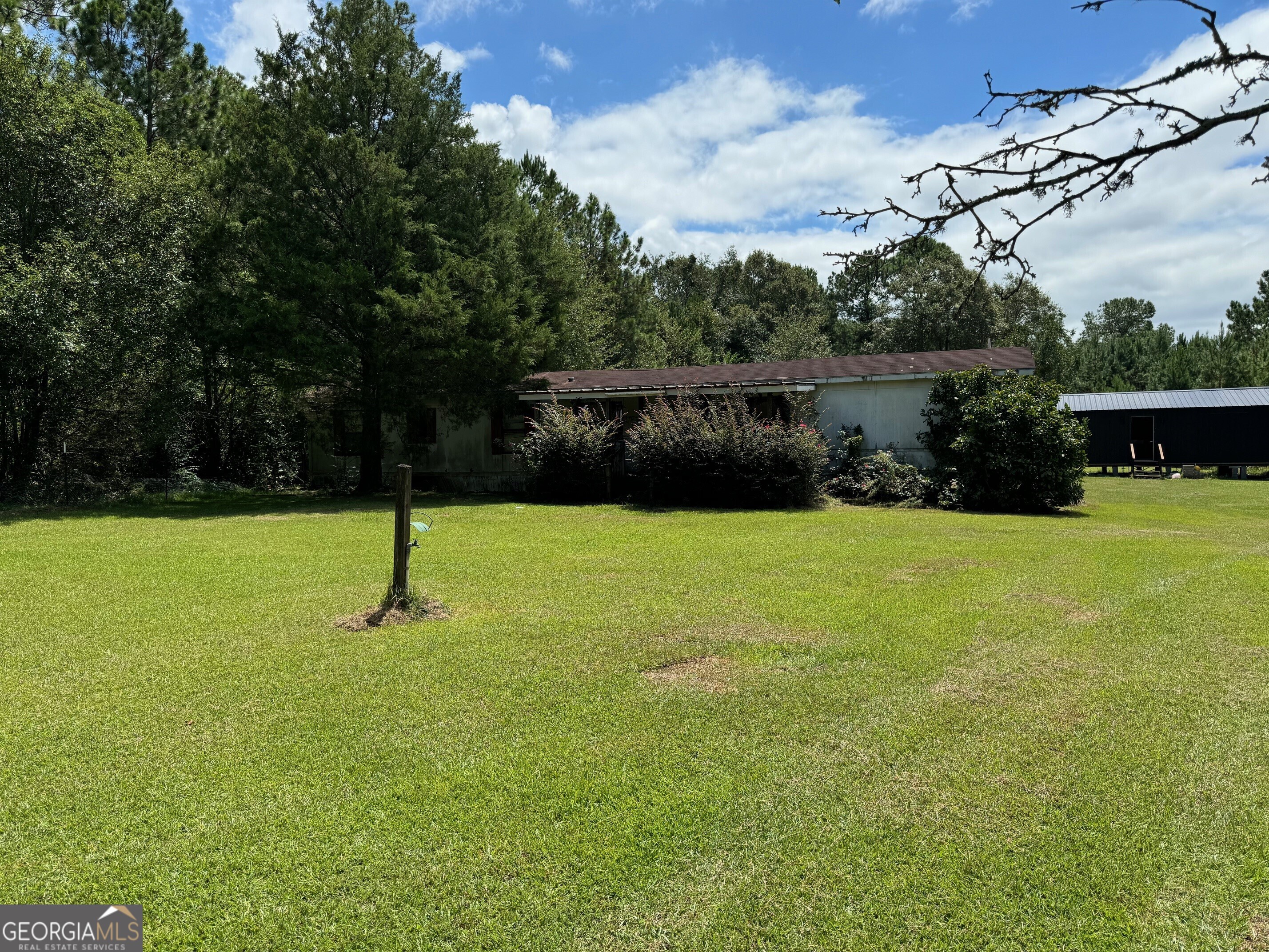 352 Pine Forest Road Ochlocknee, GA 31773 - Photo 1 of 1 a front view of a house with a yard