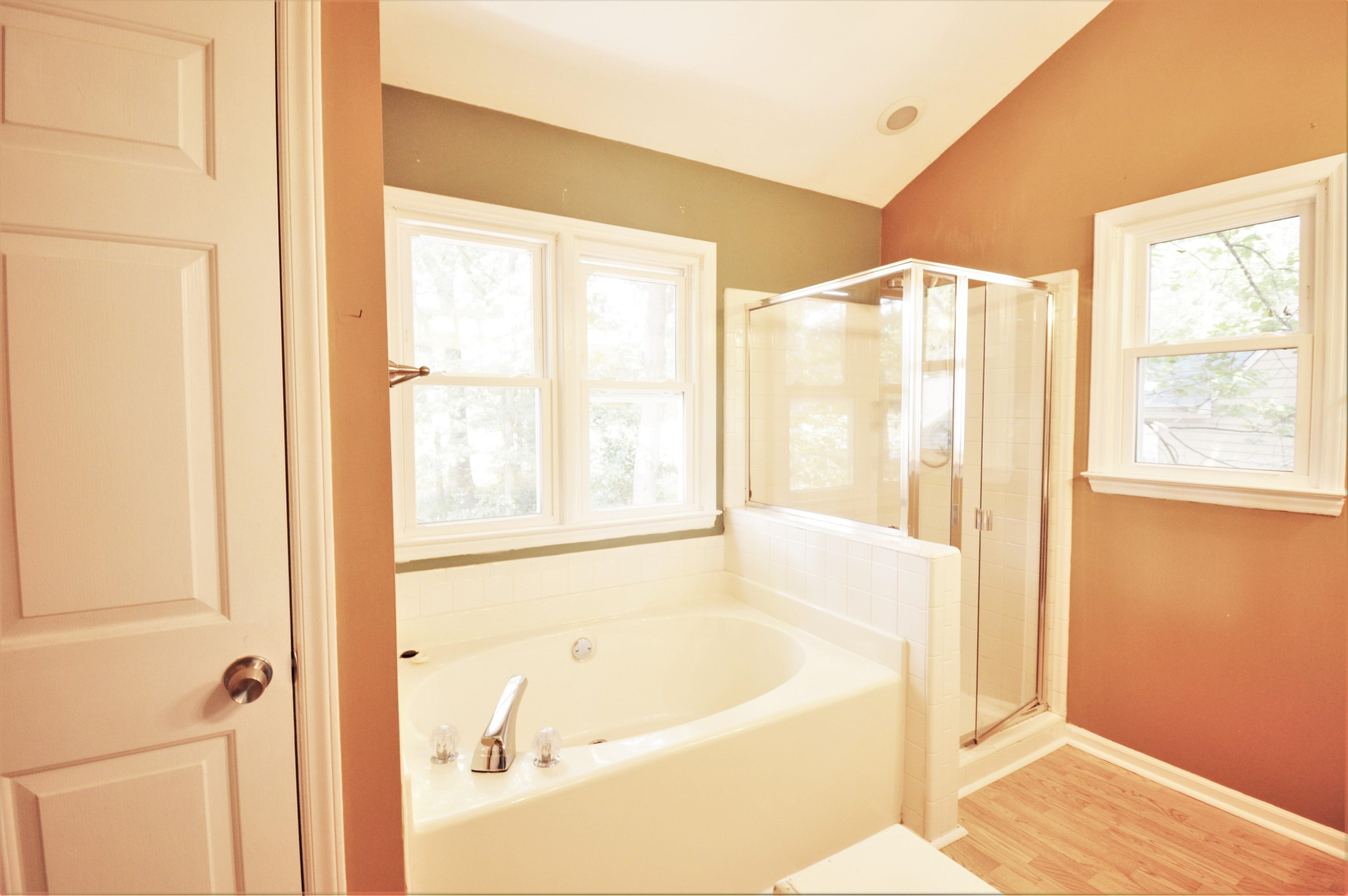 4965 Royal Adelaide Way Raleigh, NC 27604 - Photo 16 of 41 The master bath has a large soaking tub, and separate shower. The window has a view of the lush back yard and the golf course beyond. Master Bath/Spa