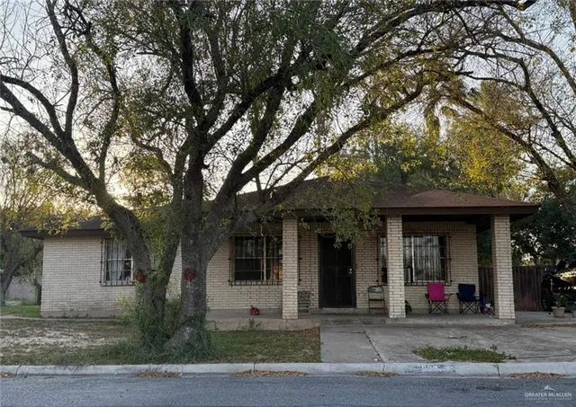 a view of a trees in front of a house