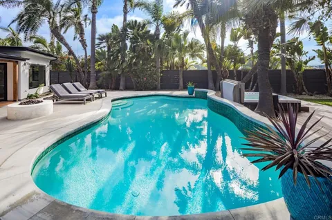 a view of a swimming pool with a patio