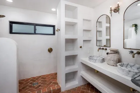 a bathroom with a tub and shower