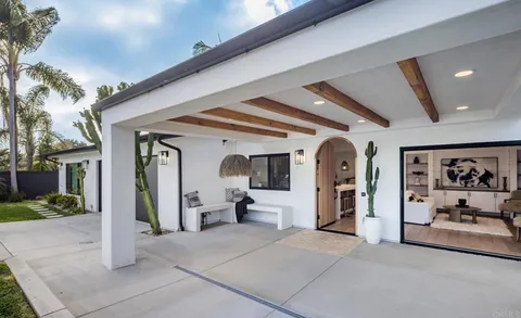 a view of living room and bedroom with furniture