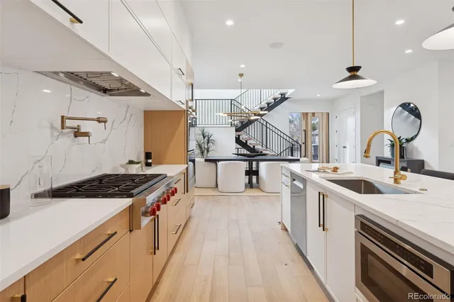 a kitchen with a stove and a sink