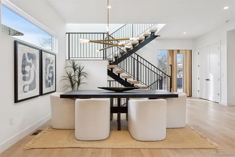 a view of a balcony with wooden floor and bench