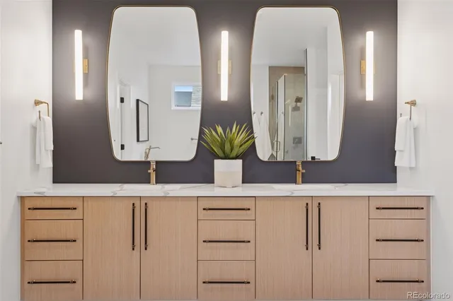 a bathroom with a double vanity sink and a mirror