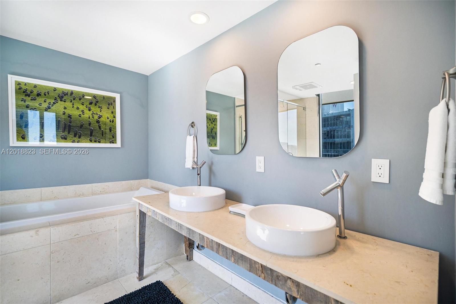 495 Brickell Avenue, Unit 4911 Miami, FL 33131 - Photo 24 of 35 a bathroom with a double vanity sink and a mirror