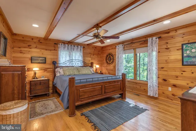 a bathroom with a granite countertop sink mirror vanity and toilet