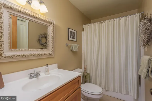 a view of a livingroom with furniture and a window