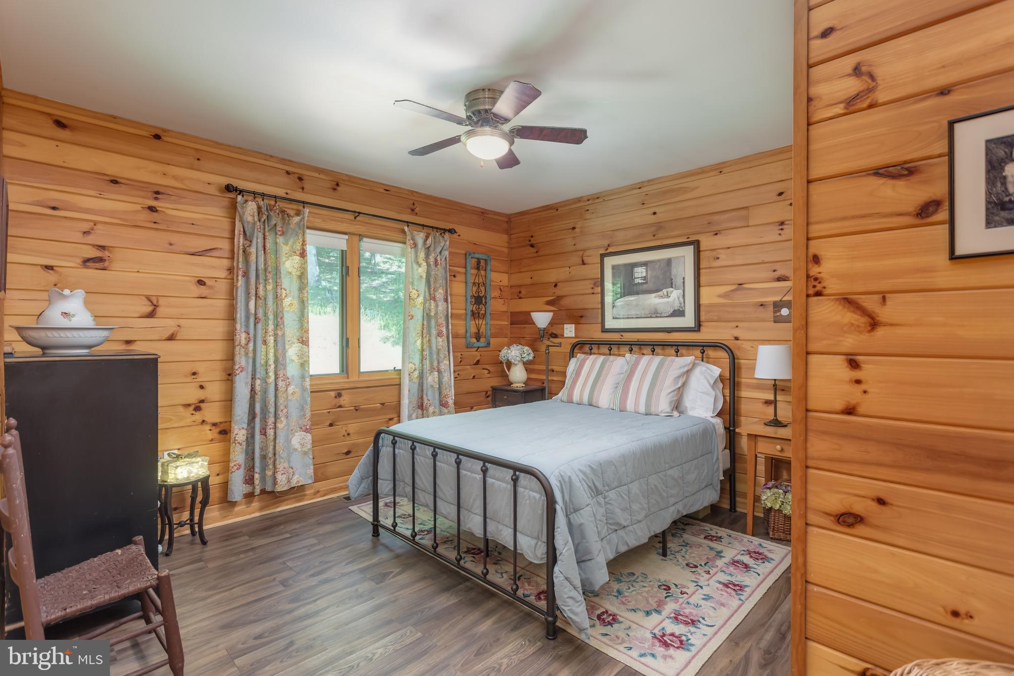379 Wintergreen Way Berkeley Springs, WV 25411 - Photo 21 of 55 a bedroom with a bed and wooden floor