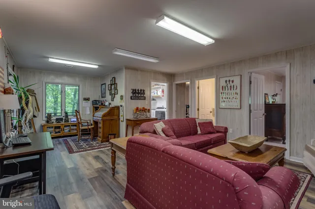 a bedroom with a bed a lamp and a window