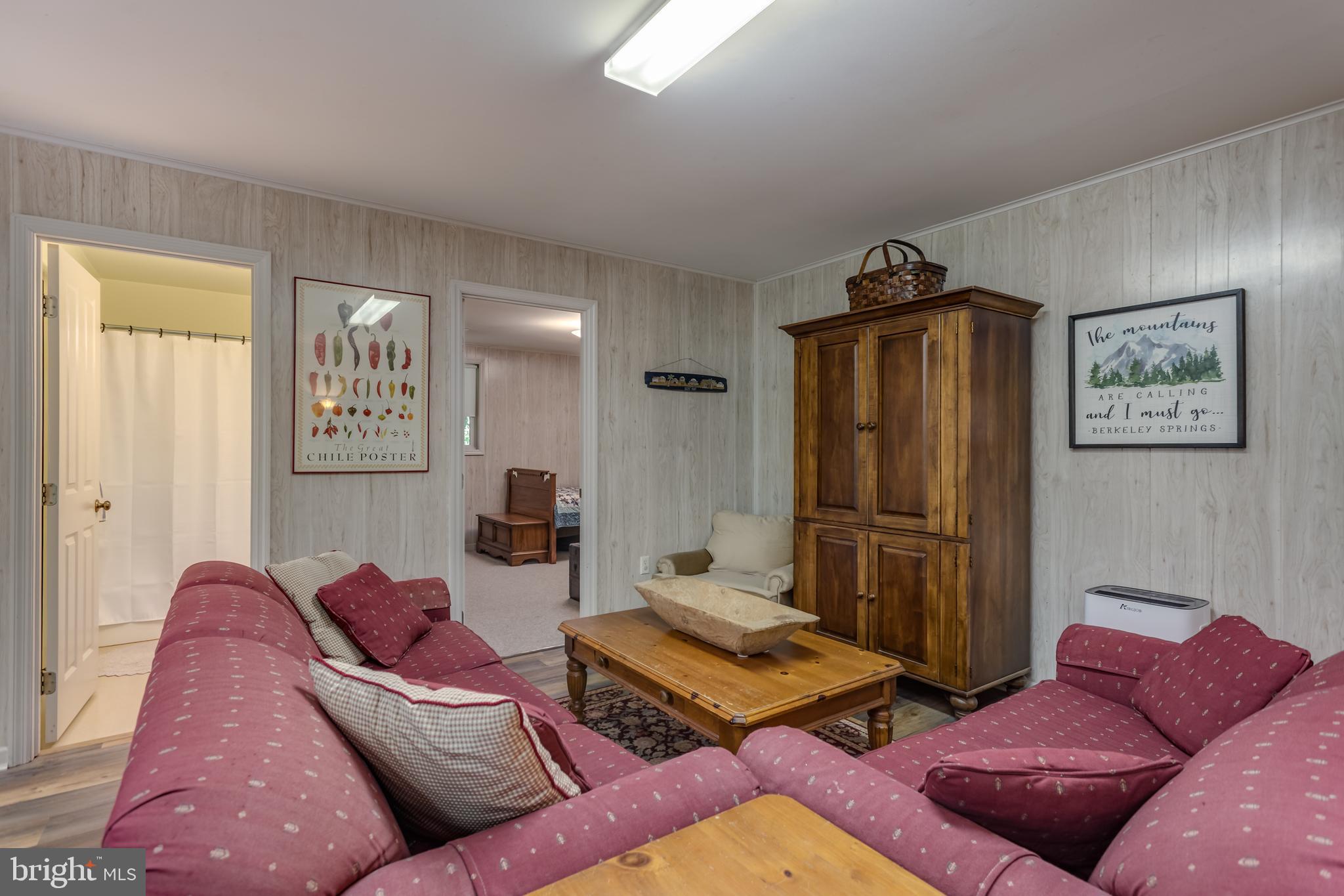 379 Wintergreen Way Berkeley Springs, WV 25411 - Photo 25 of 55 a living room with furniture and a window