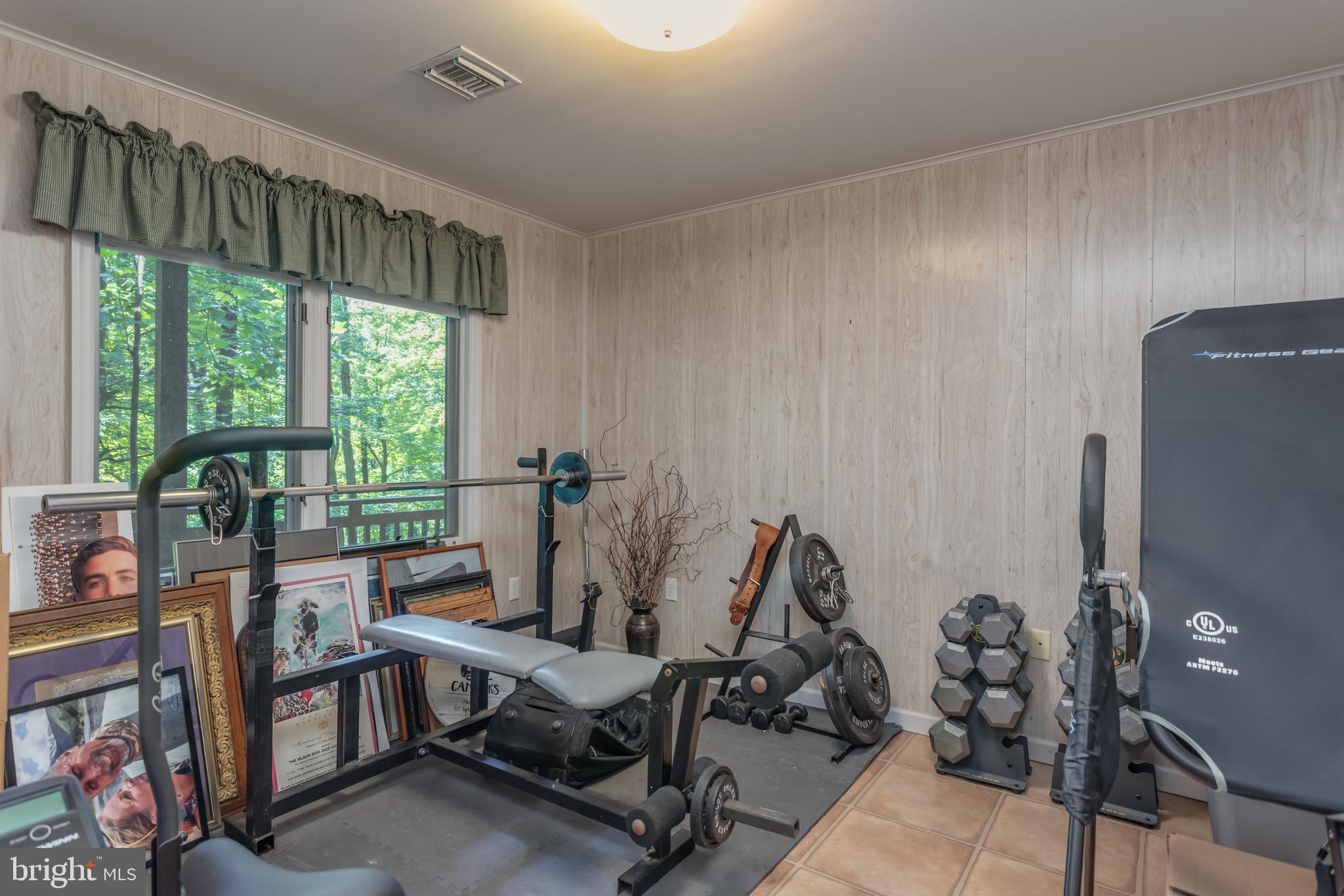 379 Wintergreen Way Berkeley Springs, WV 25411 - Photo 30 of 55 a view of a workspace with furniture and a window