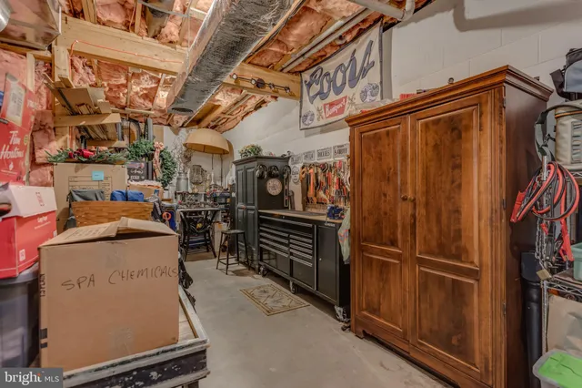 a living room with furniture and floor to ceiling windows