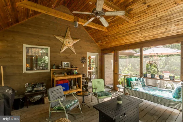 an outdoor space with furniture and umbrella