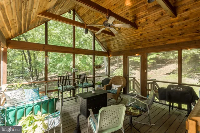 a view of balcony with furniture and wooden deck