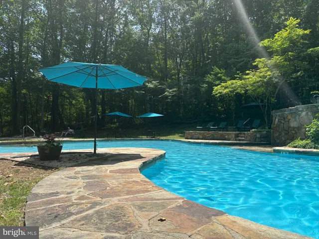 a view of a big yard with lots of green space