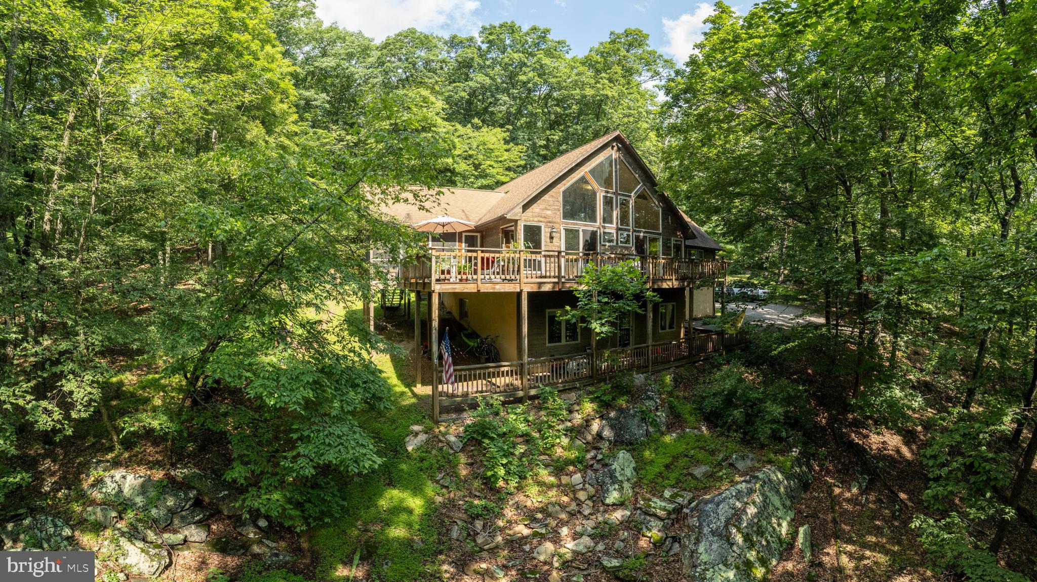 379 Wintergreen Way Berkeley Springs, WV 25411 - Photo 53 of 55 a front view of a house with yard and green space