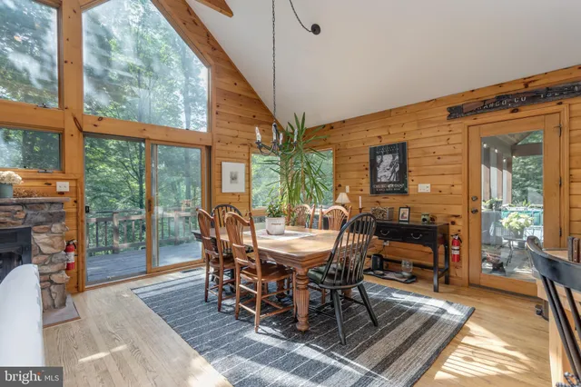 a living room with lots of furniture and a large window