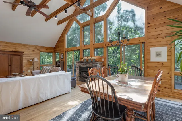 a living room with furniture and a view of kitchen