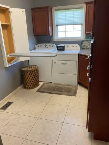 a room with a stove top oven and sink