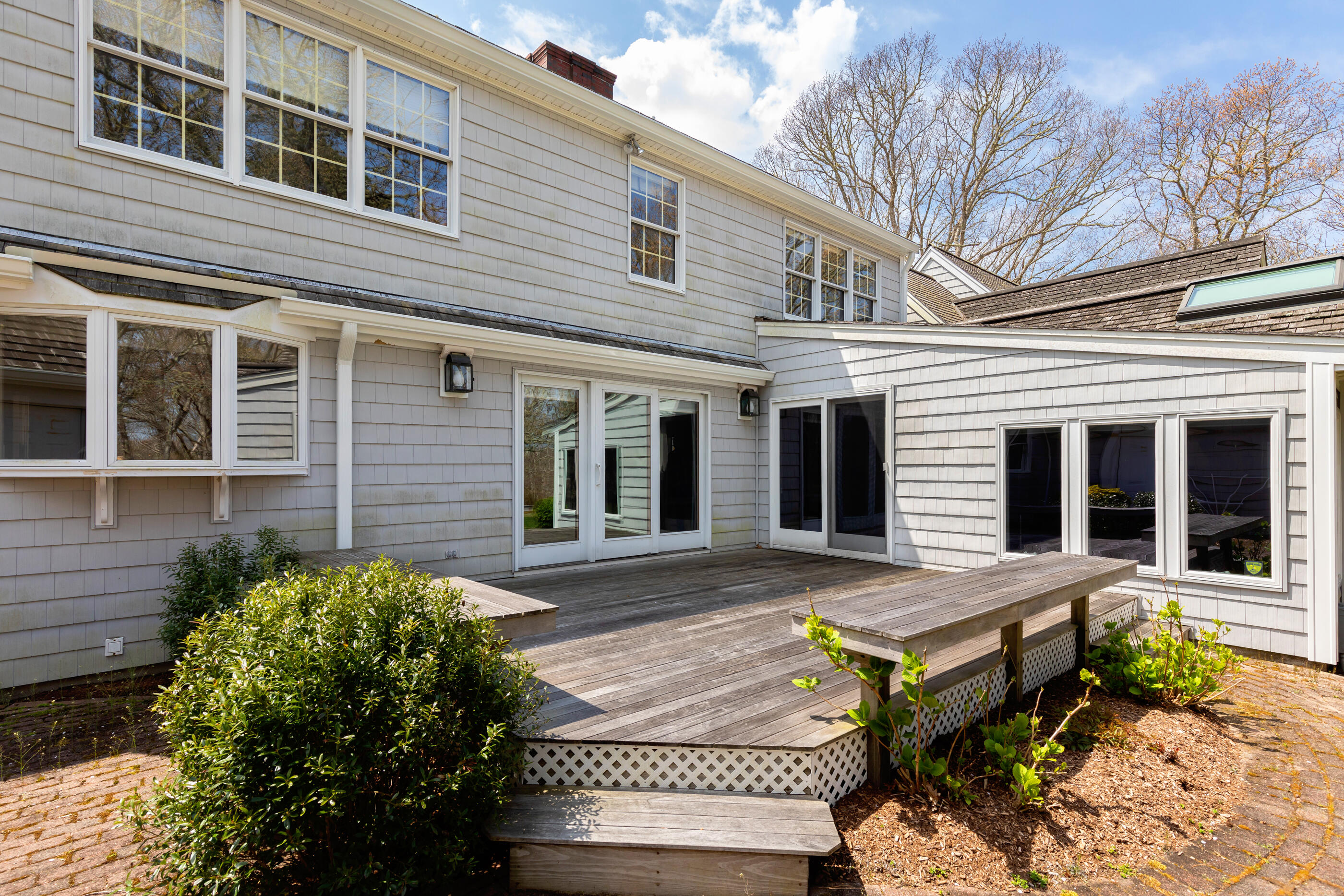 5 Shepherds Quay Brewster, MA 02631 - Photo 13 of 67 front view of a house with a lounge chair