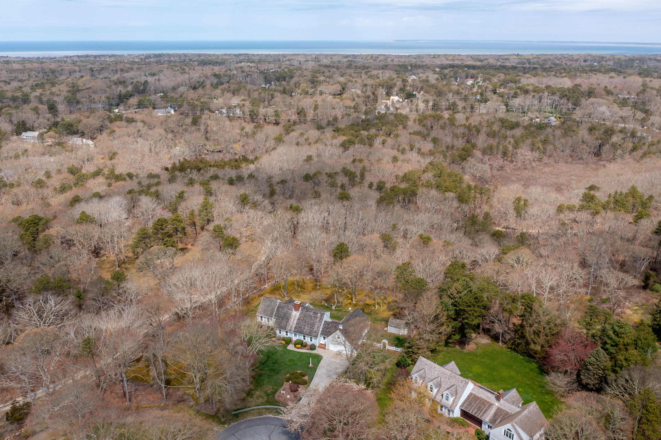 5 Shepherds Quay Brewster, MA 02631 - Photo 21 of 67 a view of a city with lush green forest