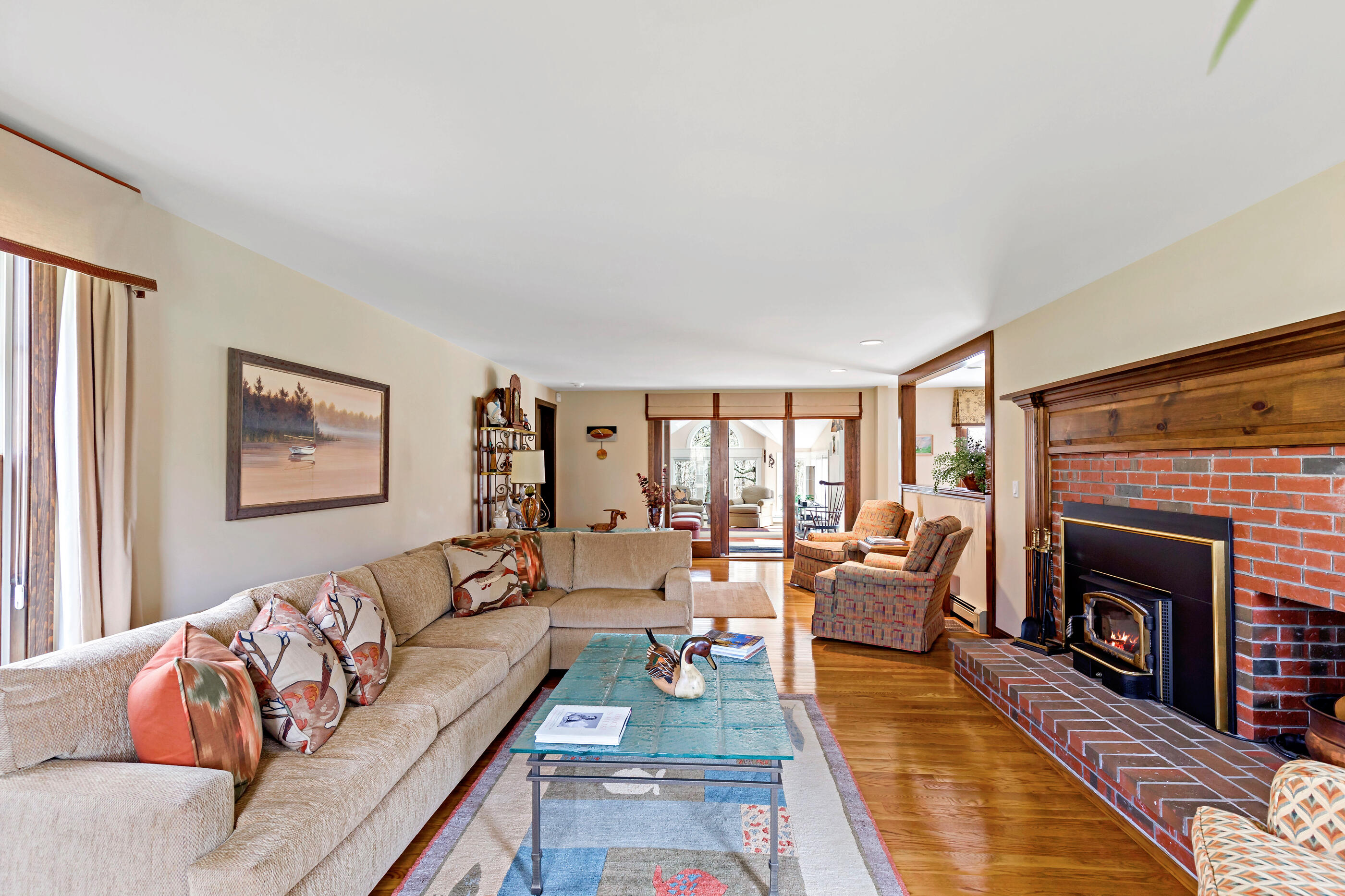 5 Shepherds Quay Brewster, MA 02631 - Photo 27 of 67 a living room with furniture and a fireplace