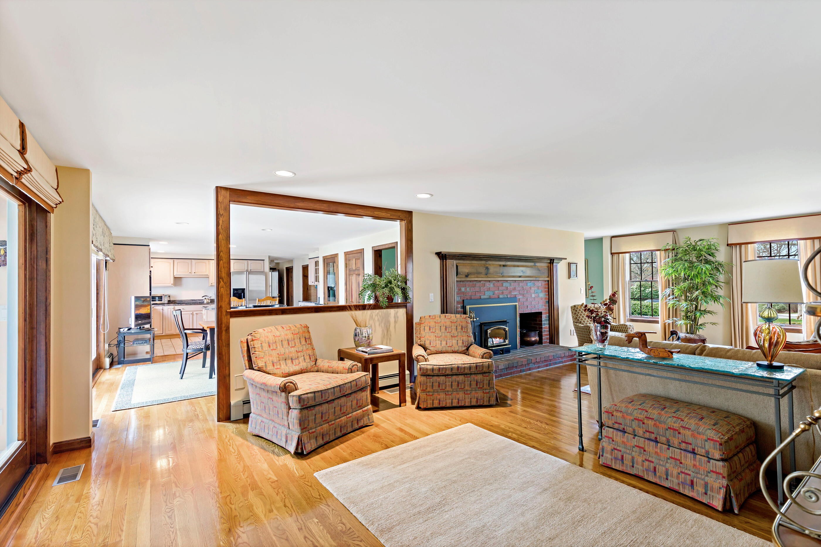 5 Shepherds Quay Brewster, MA 02631 - Photo 30 of 67 a living room with fireplace furniture and a wooden floor