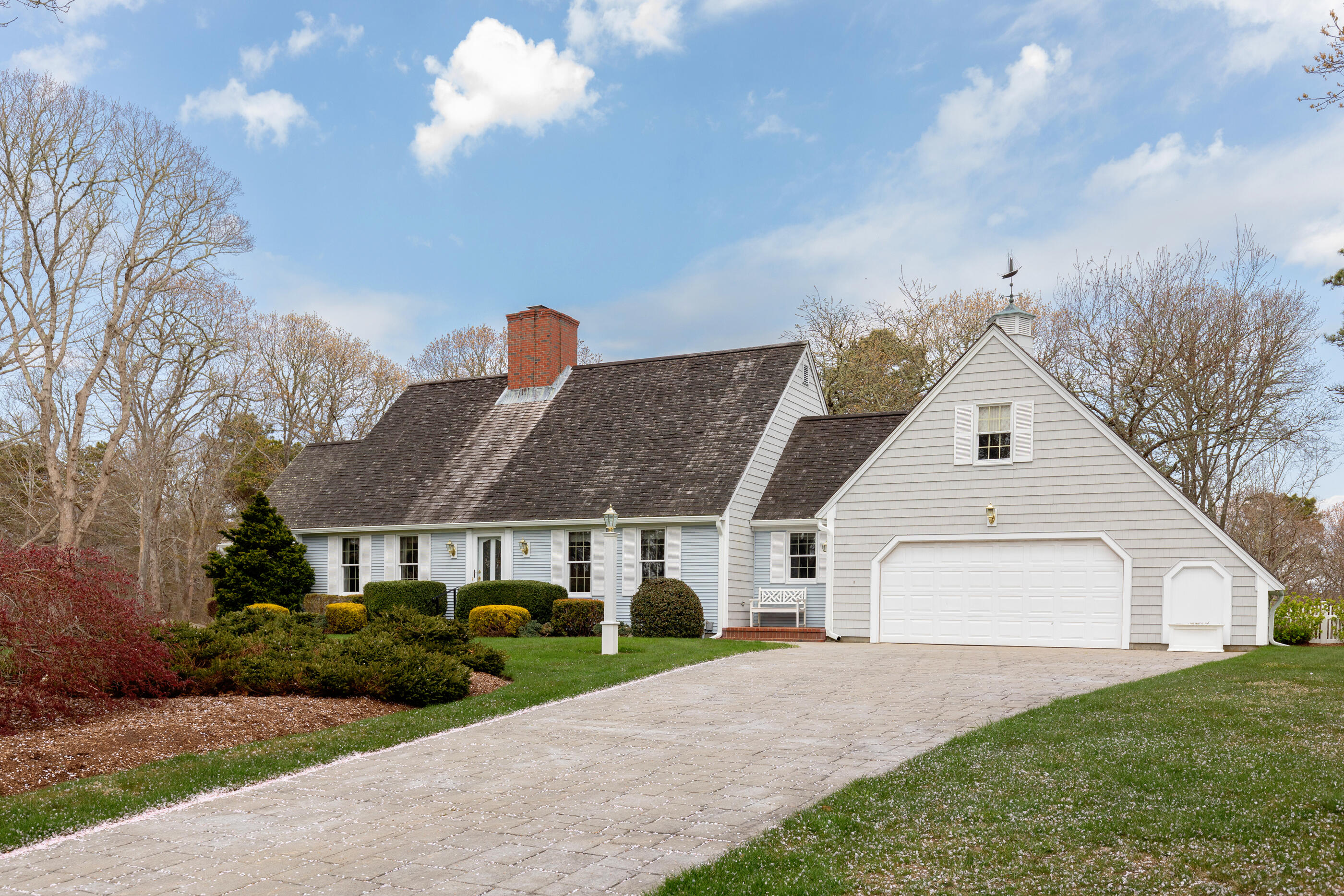 5 Shepherds Quay Brewster, MA 02631 - Photo 3 of 67 a front view of a house with a yard and garage